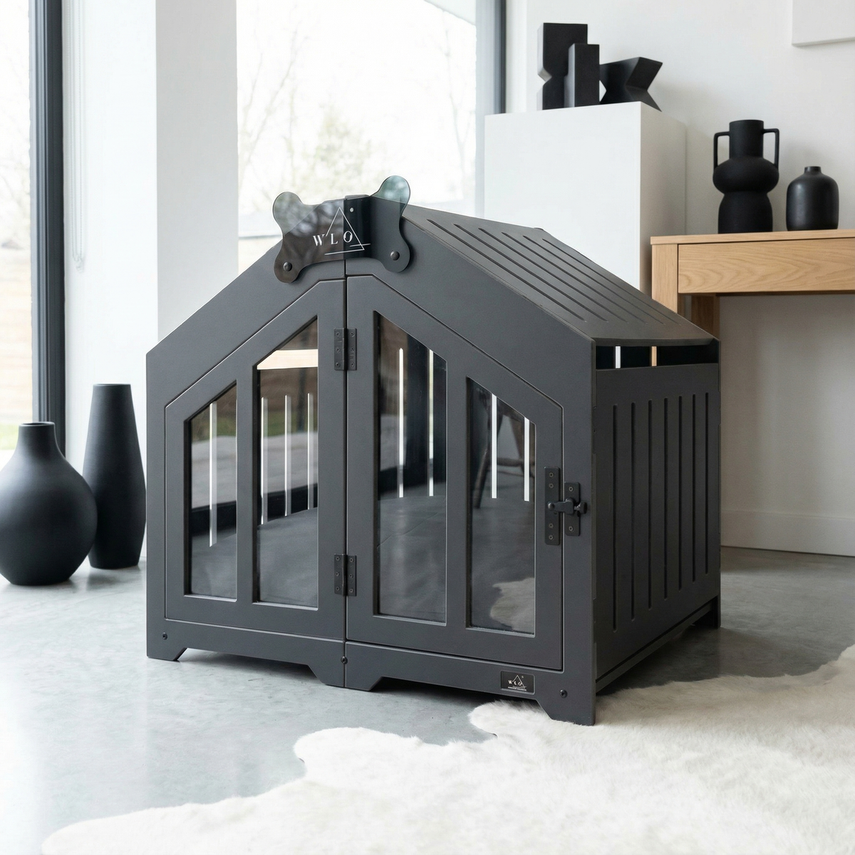 Gray pet crate with glass doors in a modern living room setting
