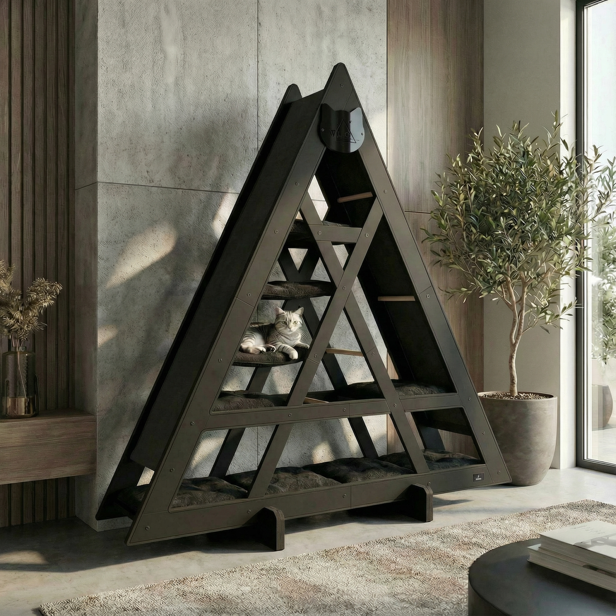 Triangular cat tree in a modern living room setting with a cat resting on it.