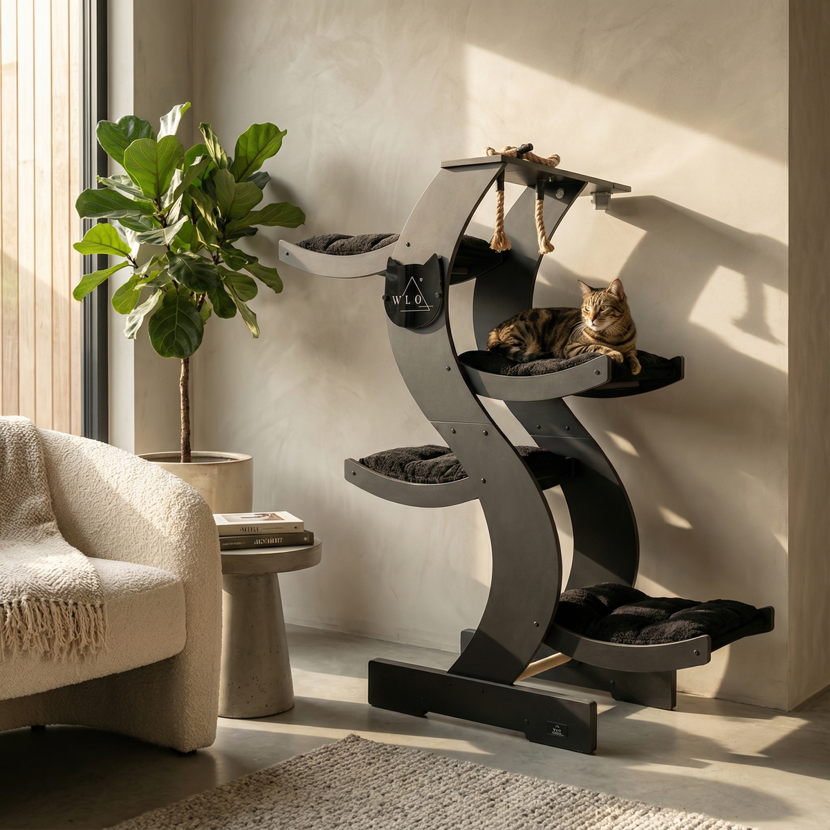 Cat tree with multiple levels and a cat sitting on it in a home setting.