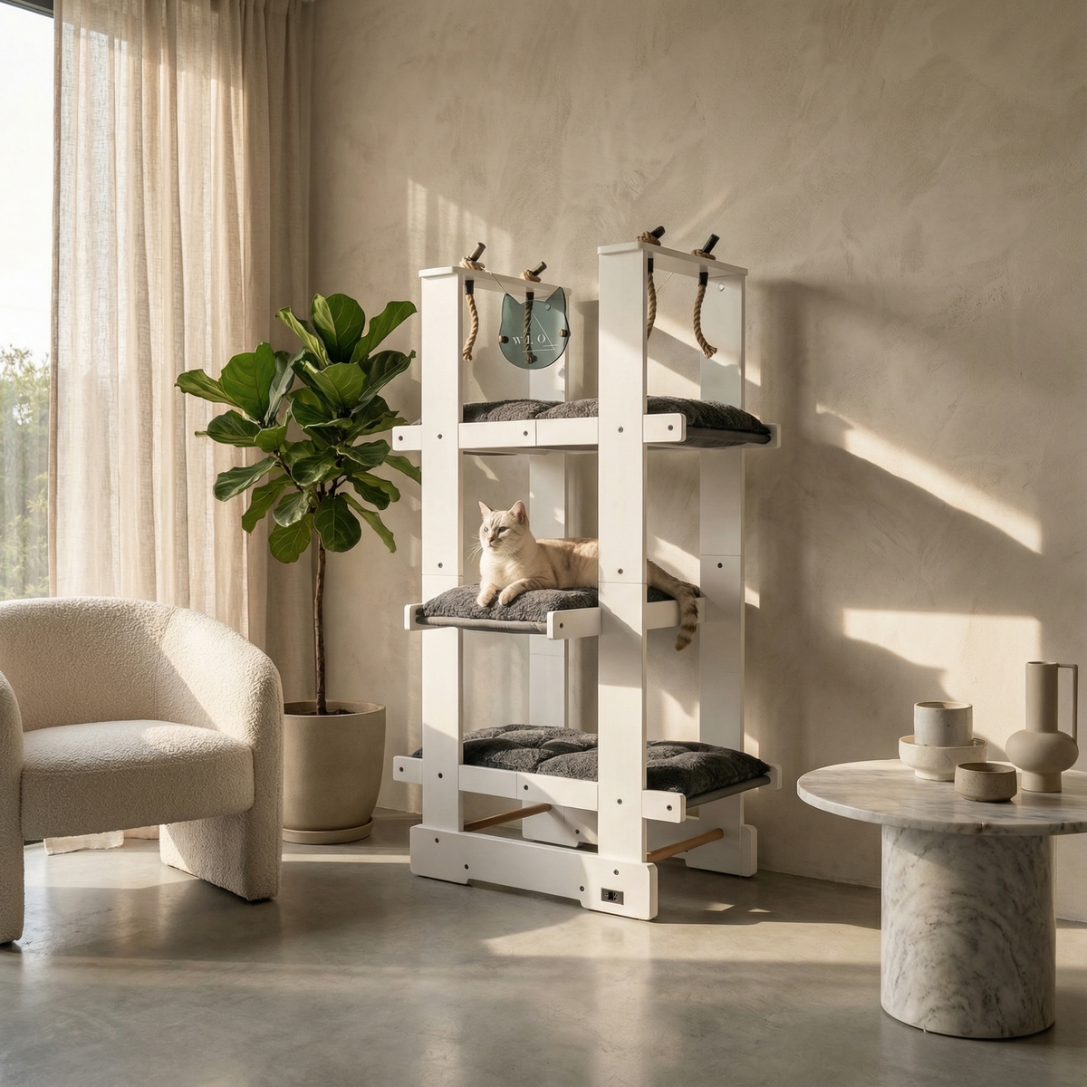 Cat tree in a modern living room with a cat sitting on it, a plant, and a marble table.