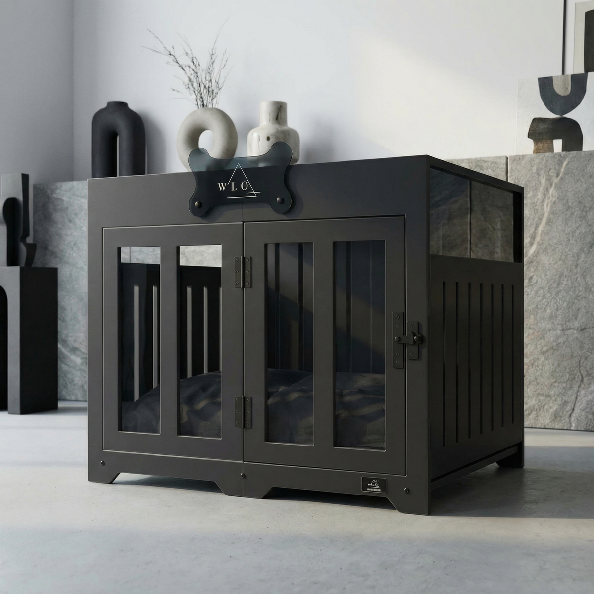 Black pet crate with 'W.L.O' branding in a modern interior setting.