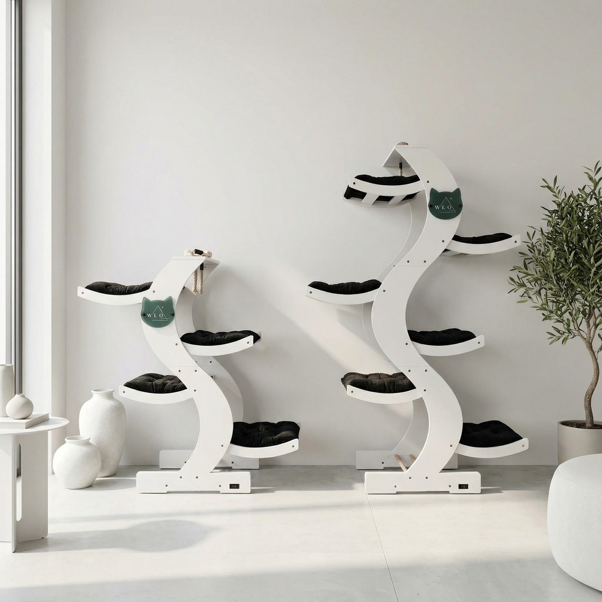 White cat tree with multiple levels and platforms in a minimalistic room.
