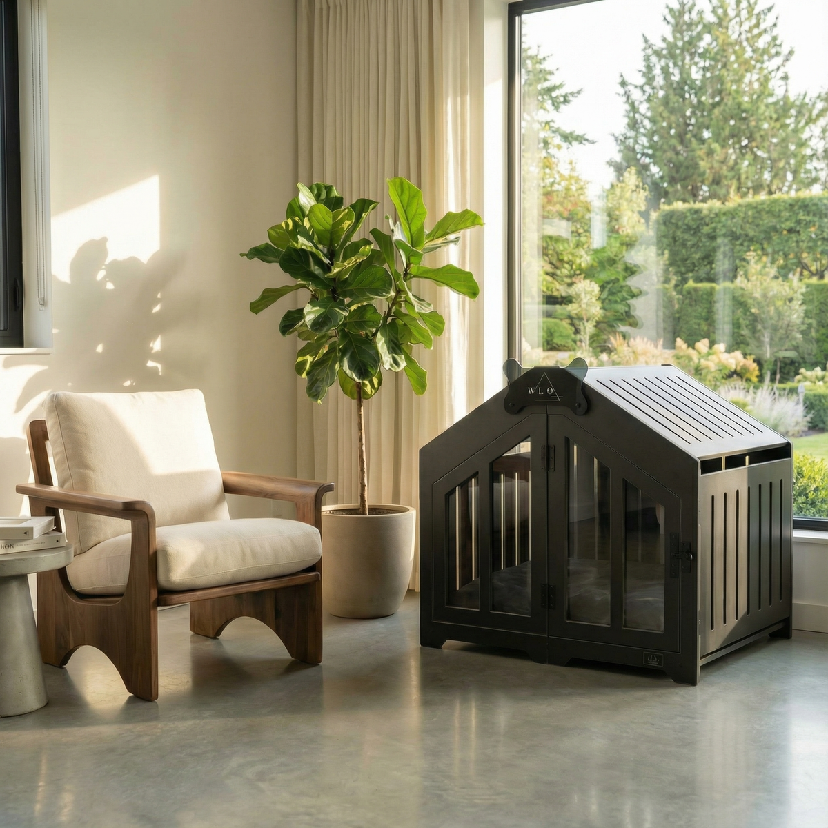 Black pet crate in a modern living room with a plant and chair.