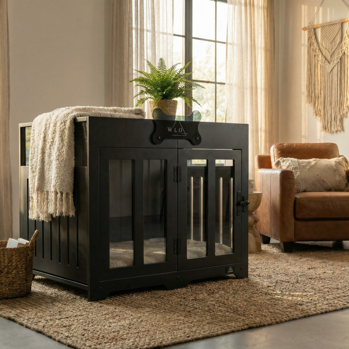 Black pet crate in a room with a couch, plant, and rug.