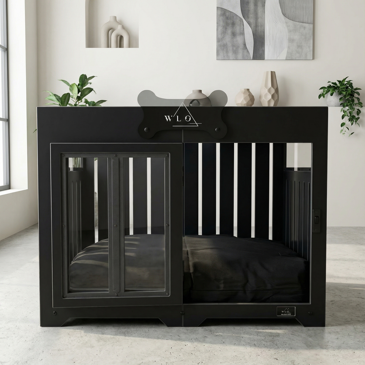 Black pet crate with 'WLO' branding in a room with plants and abstract art.
