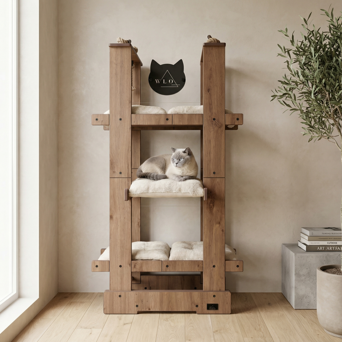 Wooden cat tree with a cat sitting on one of the shelves in a room with a plant and books.