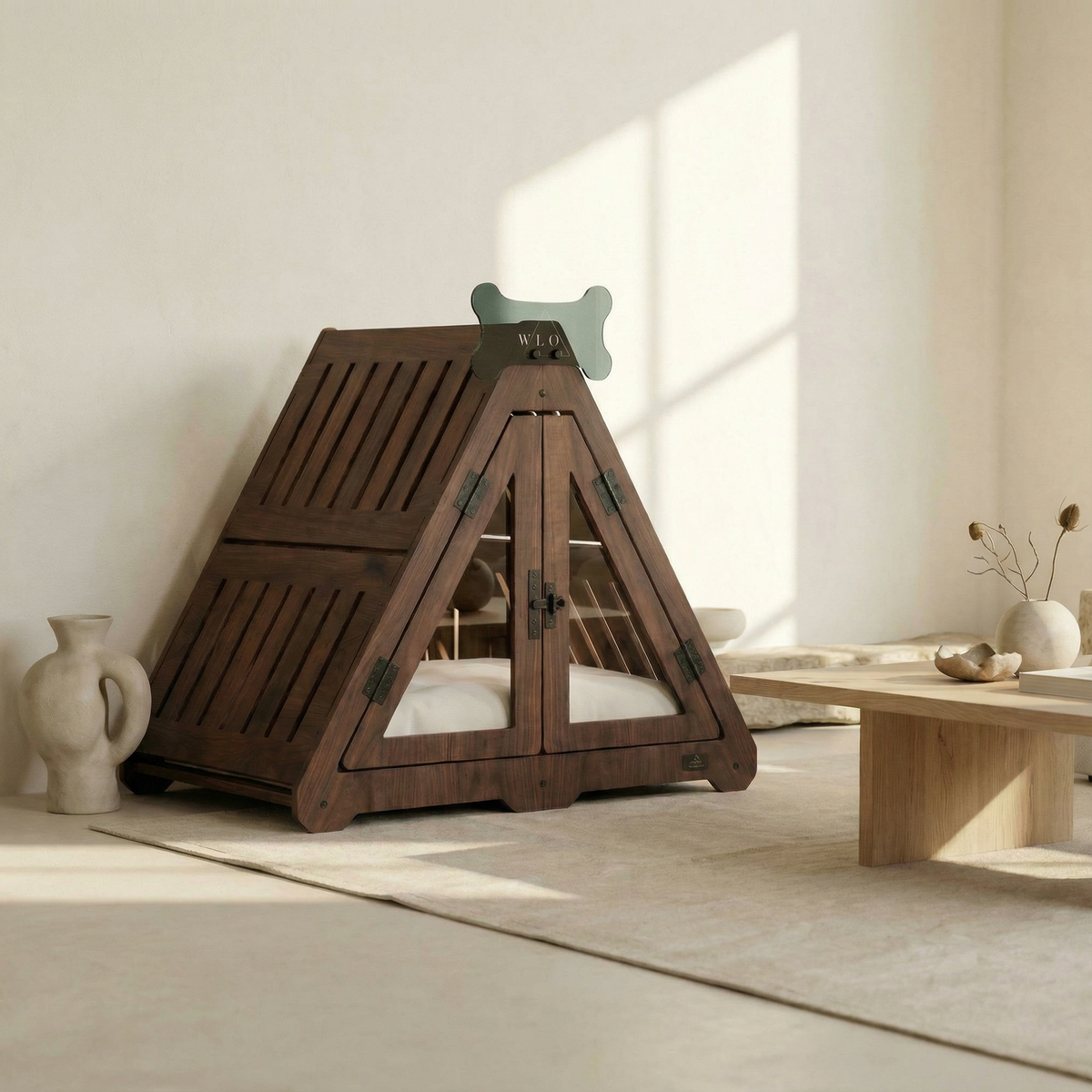 Wooden pet bed shaped like a pyramid with a white cushion inside, placed in a room with a light-colored floor and a window in the background.